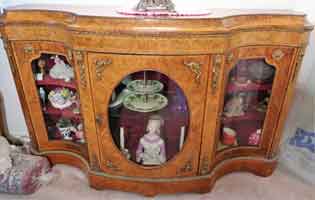 Reproduction of a late Victorian serpentine burl walnut antique credenza with gilt brass mounts   